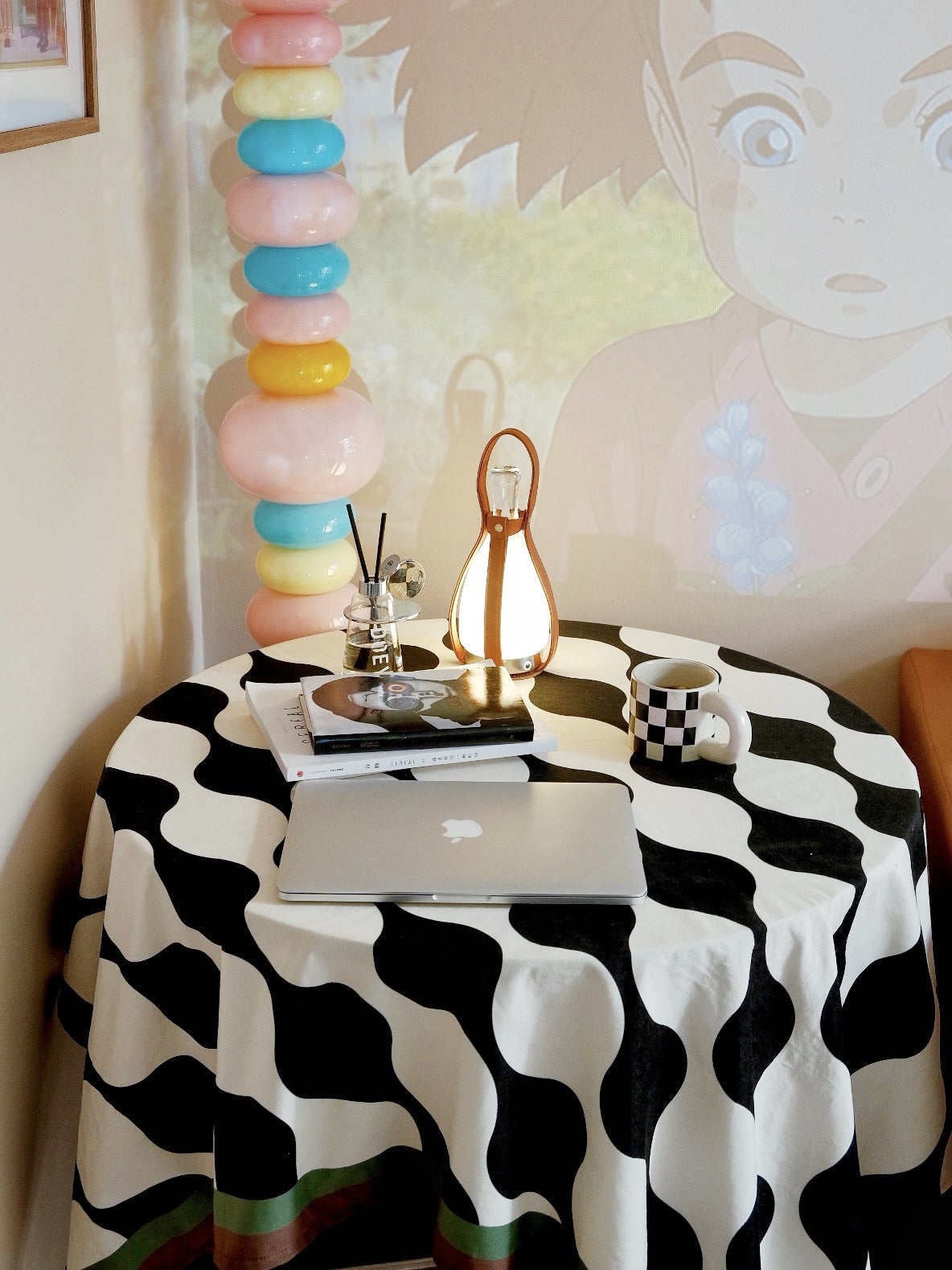 Modern LED bottle lamp on nightstand emitting soft white light.