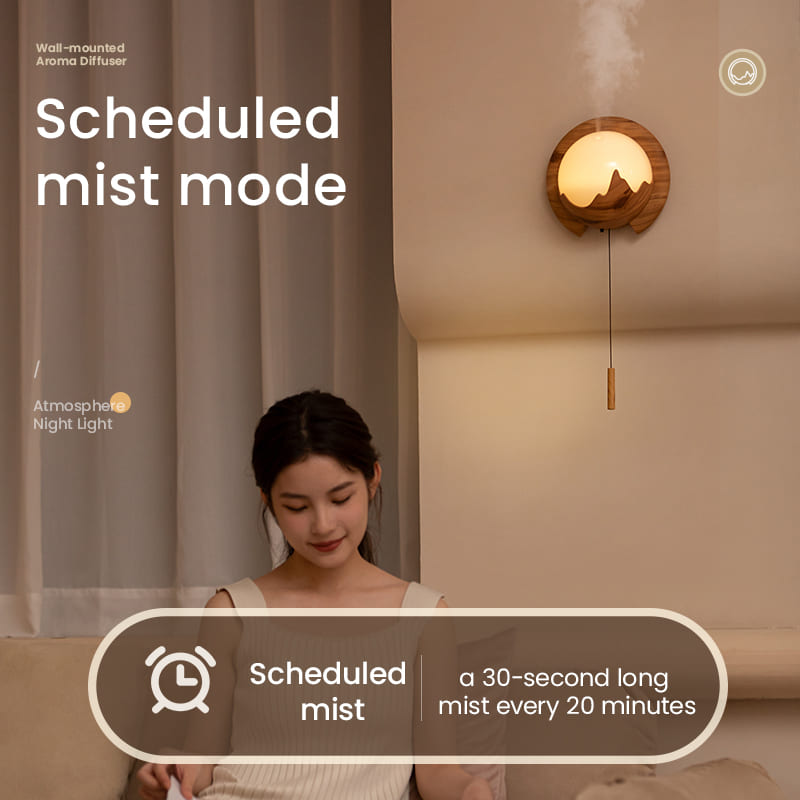 Elegant wall-mounted white aroma diffuser with night light feature.